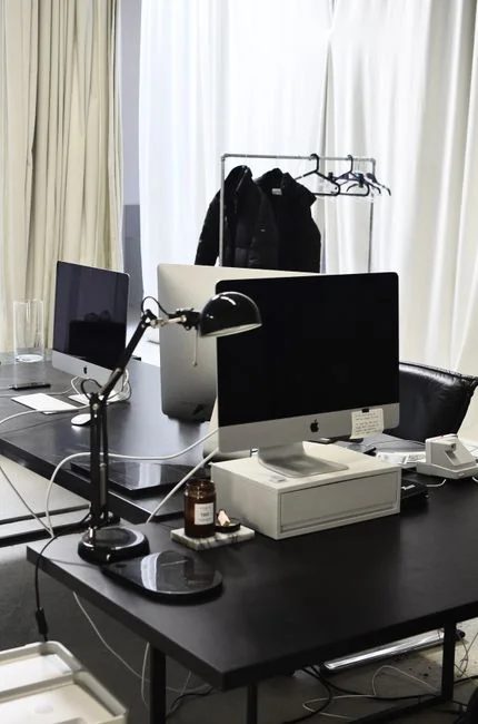A miniature shopping cart placed on a laptop keyboard symbolizing online shopping and e-commerce.